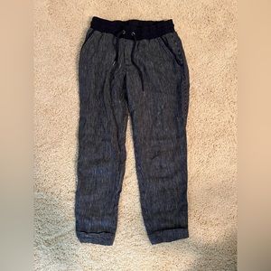 Athelta, size 2, navy blue pin stripe capris with a draw string.